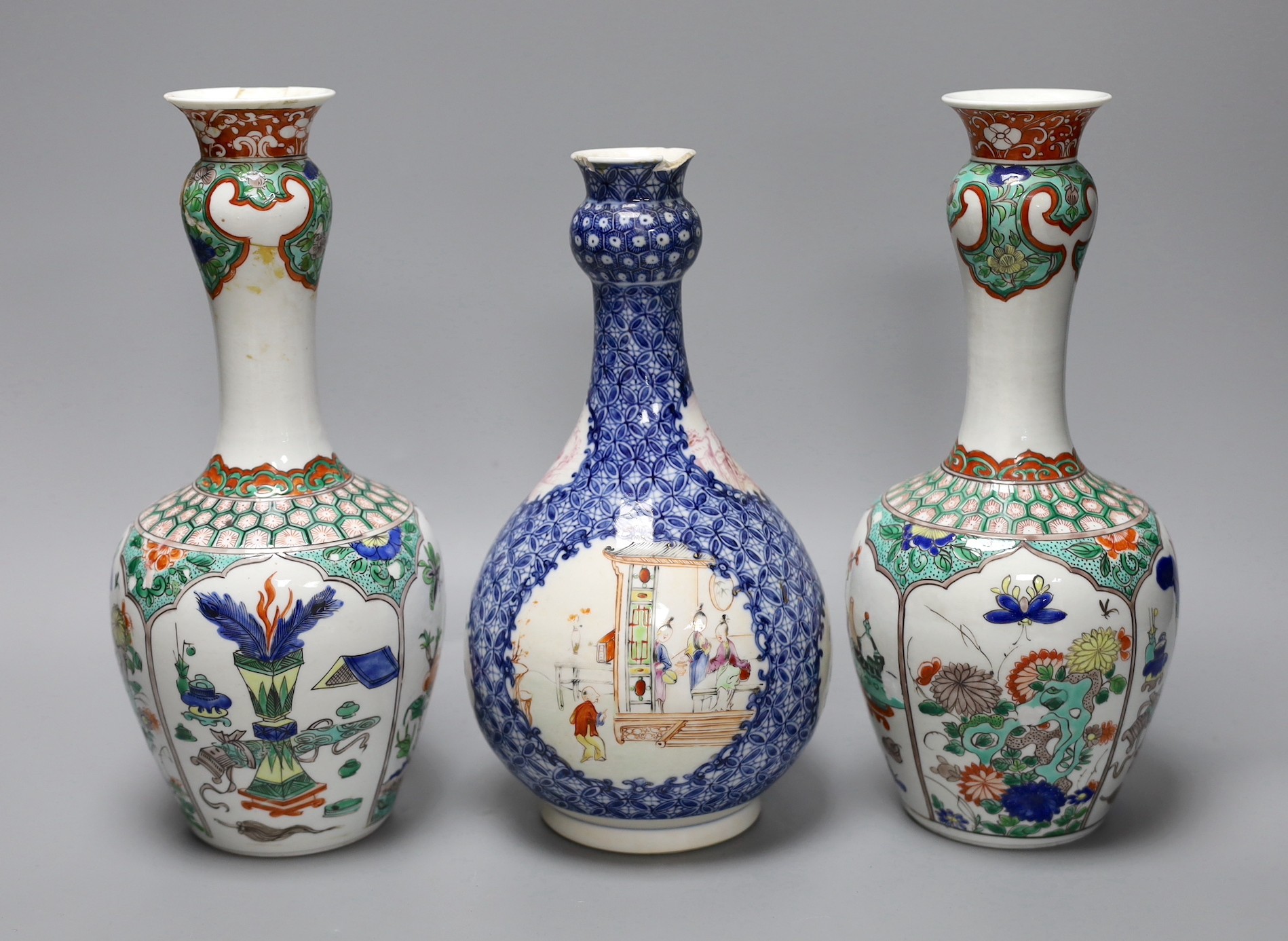 A pair Samson of Paris vases in the Chinese famille verte style and a Chinese Qianlong famille rose garlic neck vase with blue panelling motif, tallest 26cm